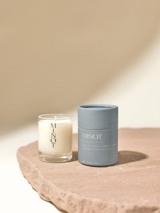 The Cerulean Tide Mini is a clean travel candle with a blend of sea salt, lemon, jasmine, and amber