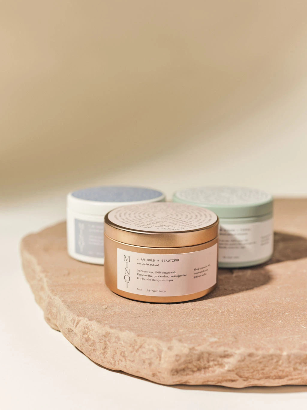 Strong + Fierce is part of the Affirmation Collection's travel candles in green, gold and white