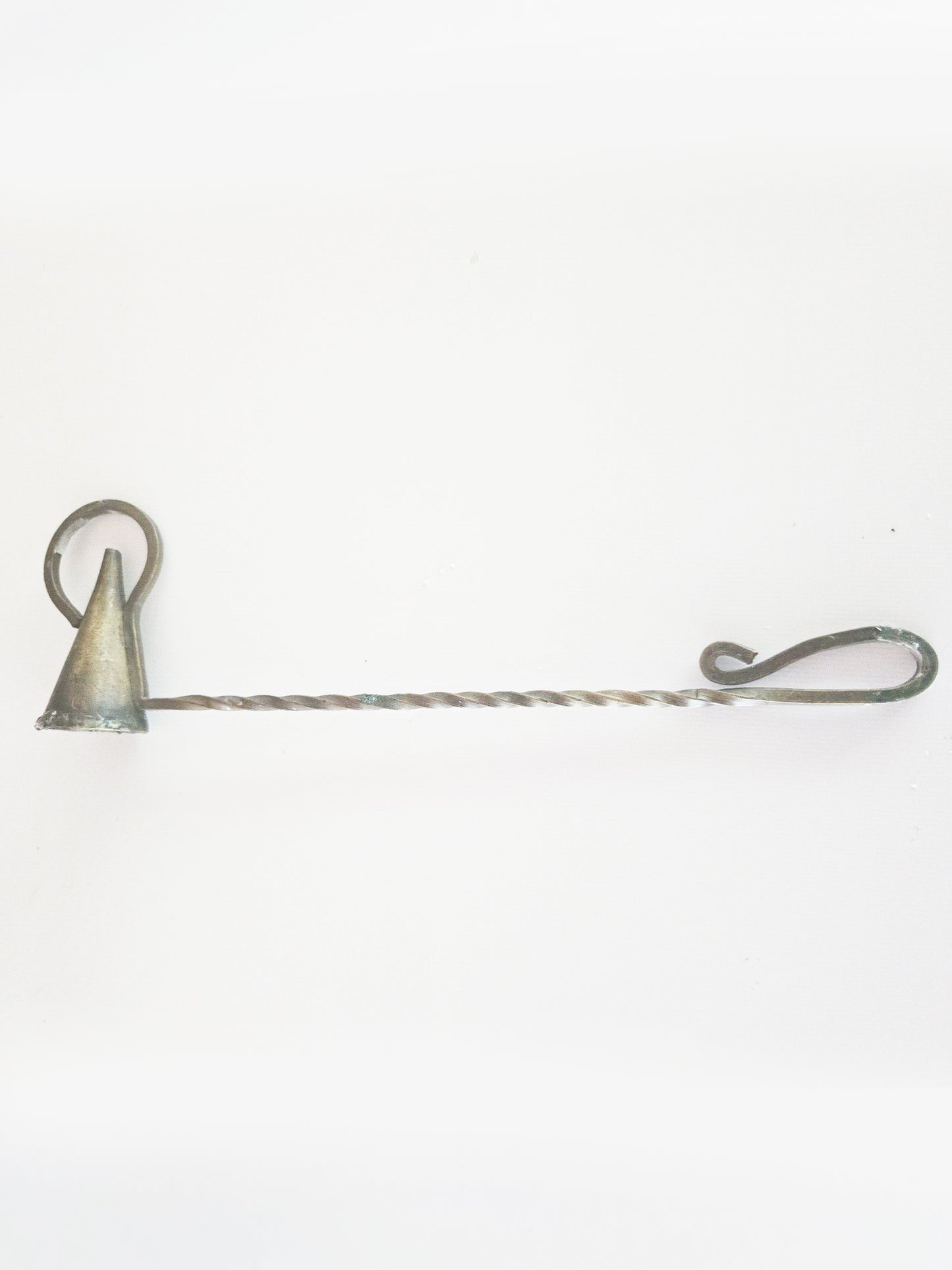A metal candle snuffer with a twisted handle and a conical extinguisher.