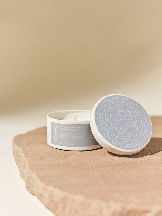 The Calm travel candle features a blend of sage, lavender and cedar for affirming, calming energy