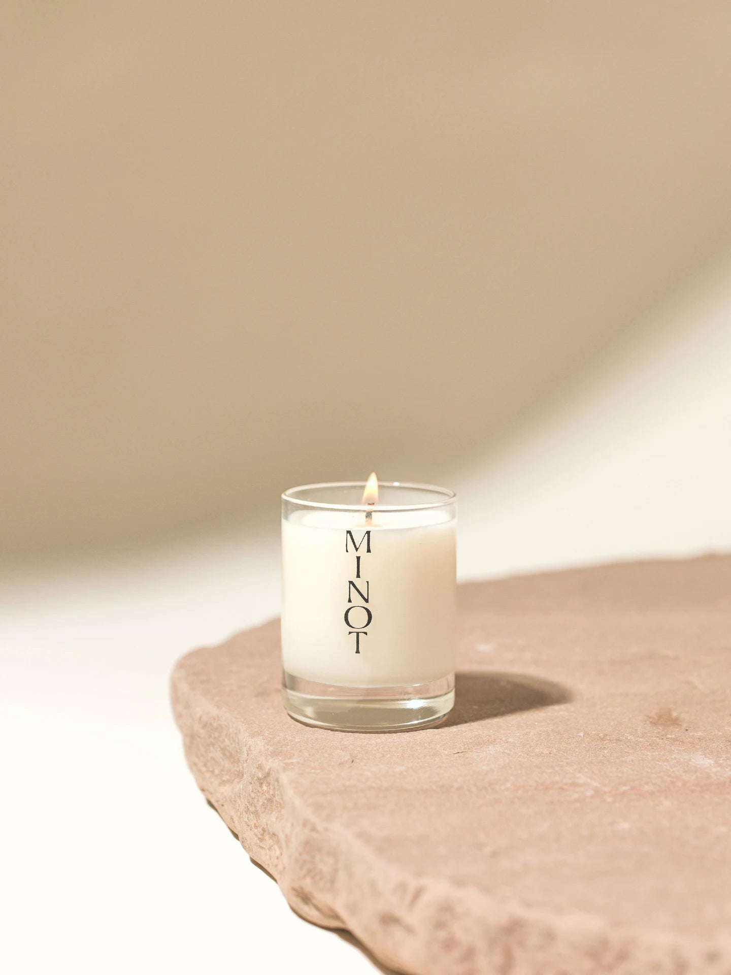 Mini Atmosphere is a non-toxic travel candle votive with scents of coconut, sandalwood and almond