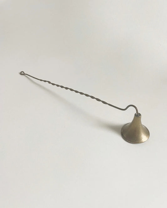 MINOT's handmade candle snuffer is 10 inches long with a fluted bell and twisted handle