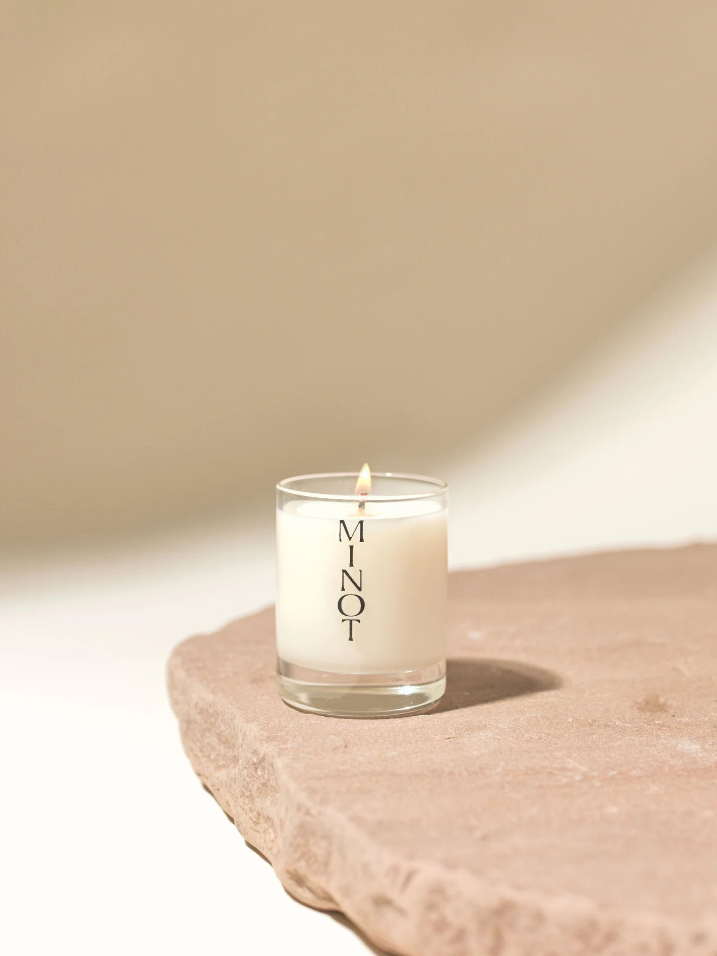 The vegan Luna Mini travel candle offers a sensual scent blend of mandarin, sandalwood, and jasmine