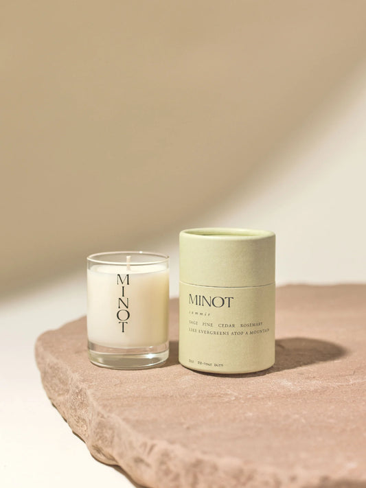 The Summit Mini candle is a cozy travel candle with a sage, pine, cedar, and rosemary scent blend