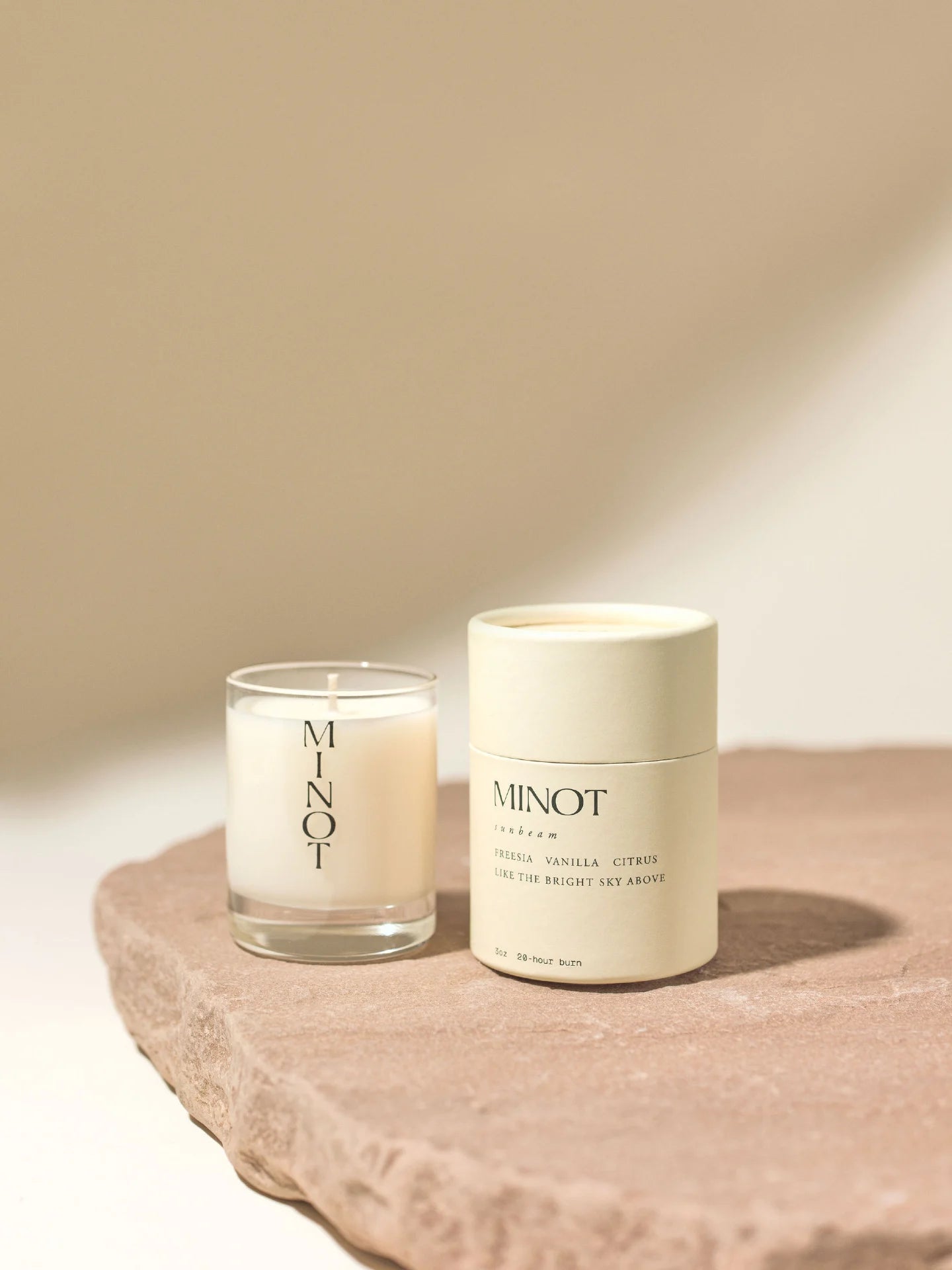 The Sunbeam Mini is a non-toxic, clean-burning soy travel candle with freesia, vanilla, and citrus