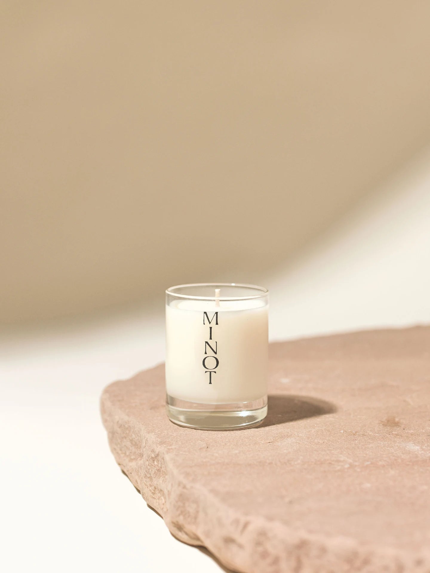 The all-natural Wild Meadow Mini soy wax candle features lilac, honeysuckle, and amyris scents